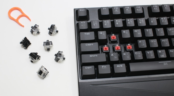 A black mechanical keyboard with several keycaps removed