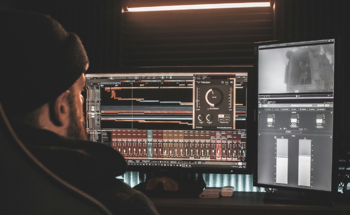 A person working on audio production software