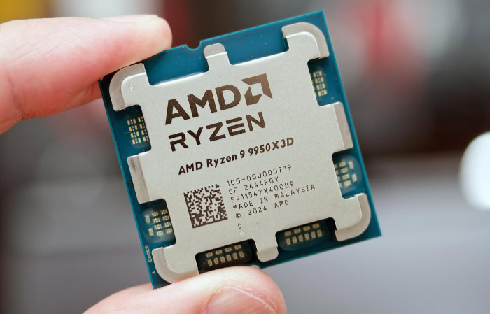 AMD Ryzen 9 9950X3D desktop CPU held in hand