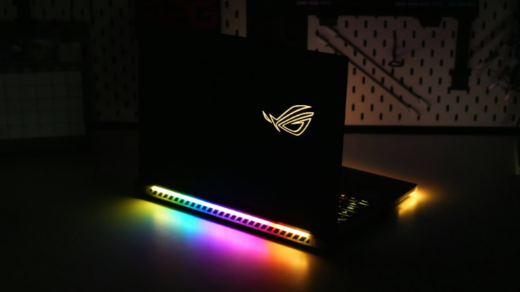 ASUS ROG gaming laptop with glowing RGB lighting