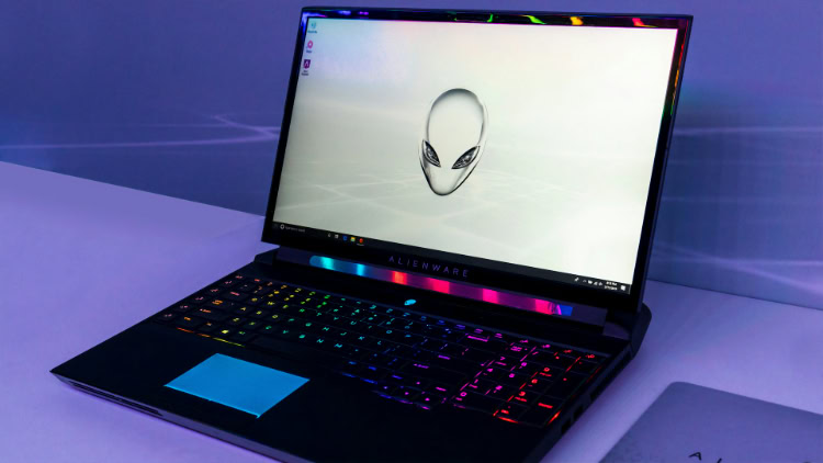 Alienware gaming laptop with illuminated keyboard and trackpad