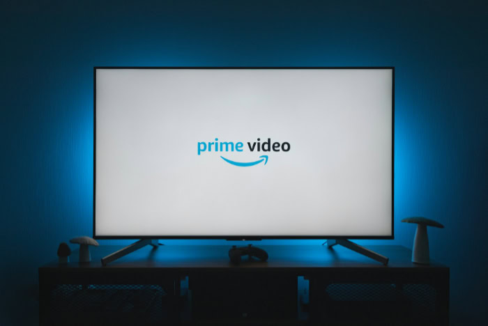 Amazon Prime Video logo on flat screen TV in dark room