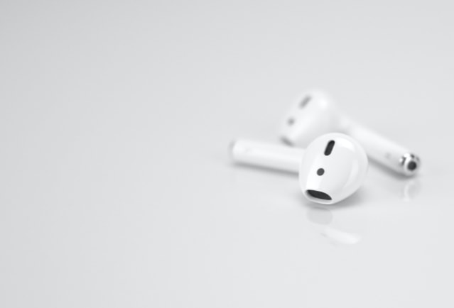 Apple Airpods on white surface