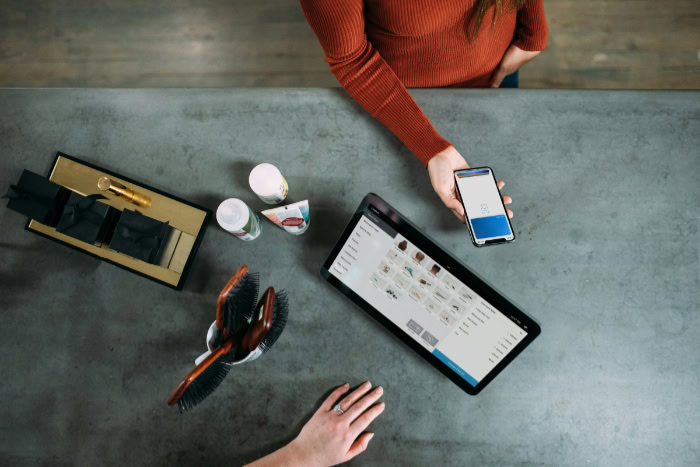 Apple Pay transaction at a retail store with a tablet