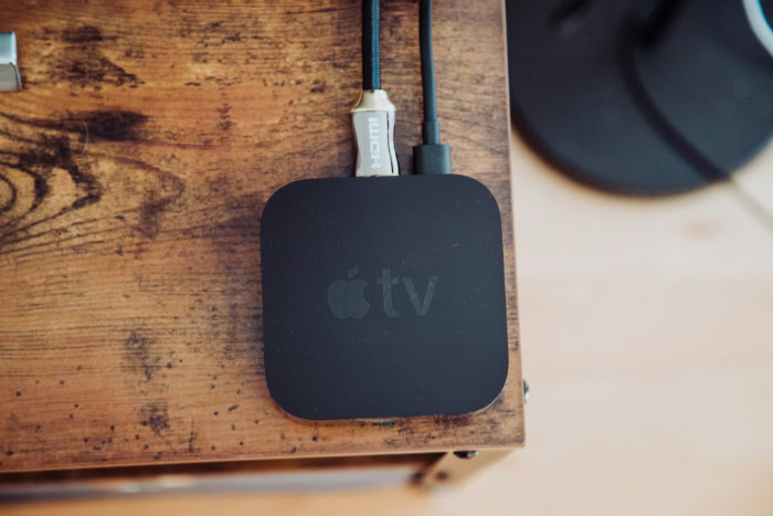 Apple TV connected via HDMI on wooden table