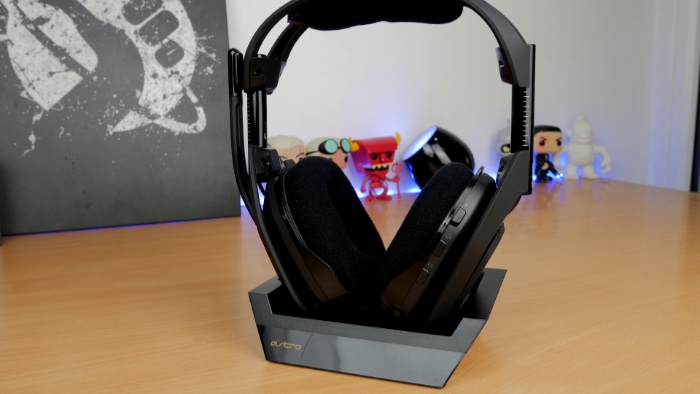 Black Astro A50 with base station on wooden table