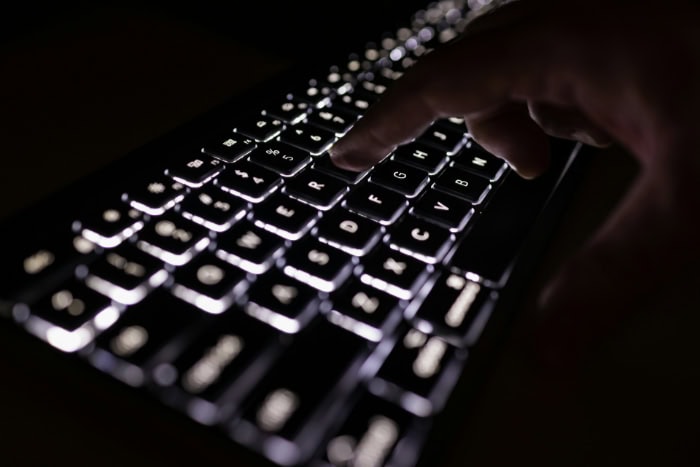 Backlit keyboard with illuminated keys in dark environment