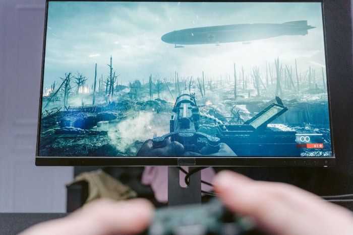 Battlefield video game scene with zeppelin airship and trenches