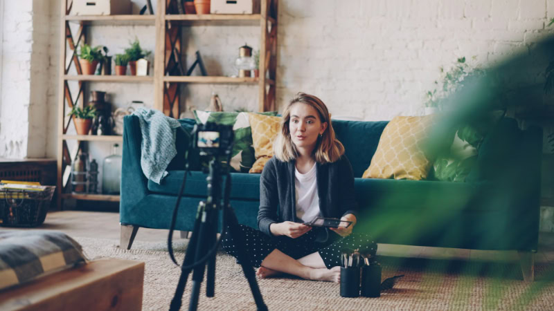 Beauty vlogger recording video with camera
