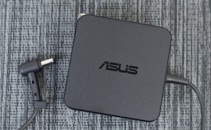 Black Asus Chromebox on textured surface