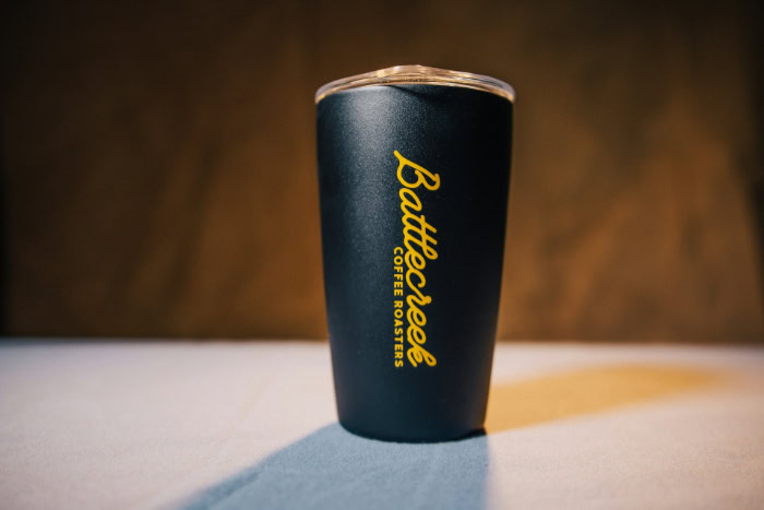 Black Battlecreek Coffee Roasters tumbler on a table