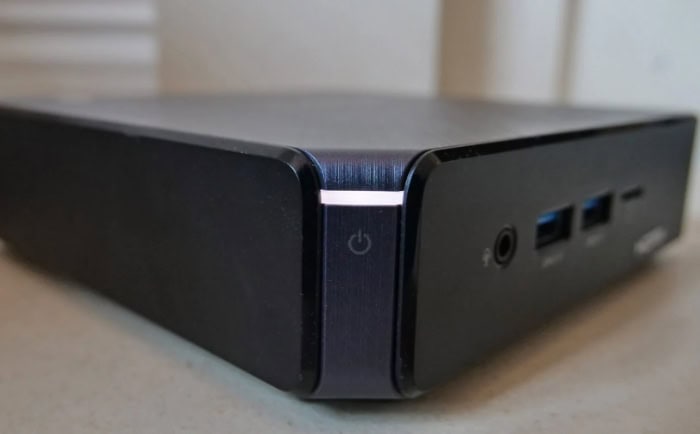 Black Chromebox device with ports and power button