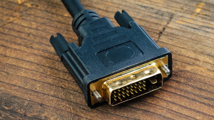 Black DVI cable connector on a wooden table