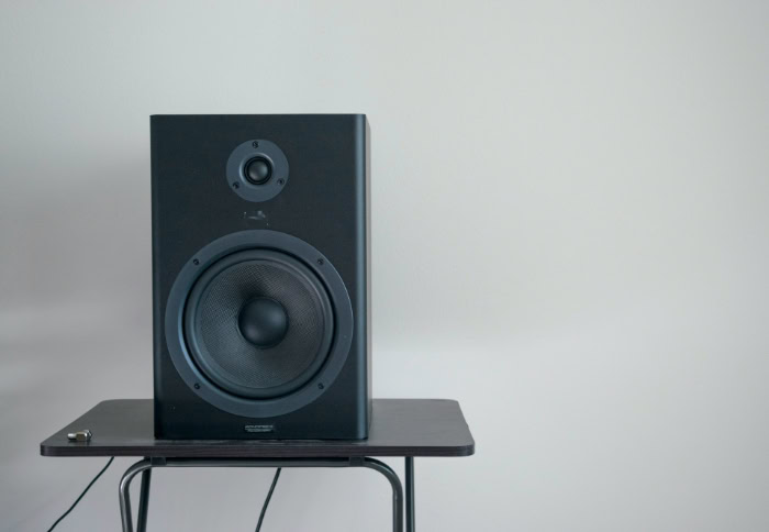 Black Monoprice studio monitor speaker on a stand