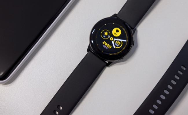 Black Smartwatch on white surface