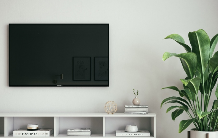 Black flat screen tv on white wall