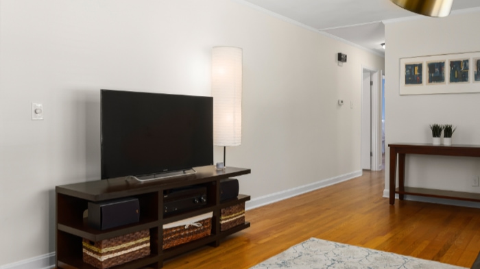 Black TV on brown desk