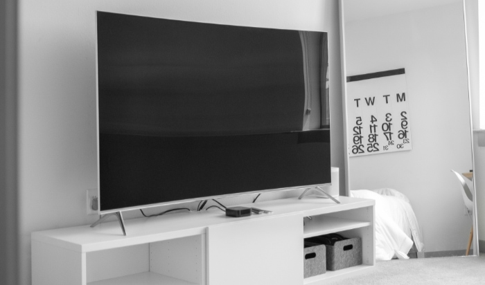 Black TV on white desk 5