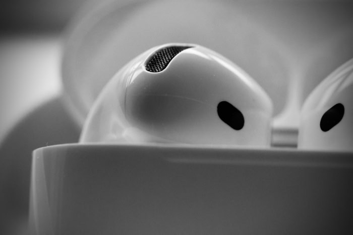 Black and white macro of Apple AirPods 4 earbud