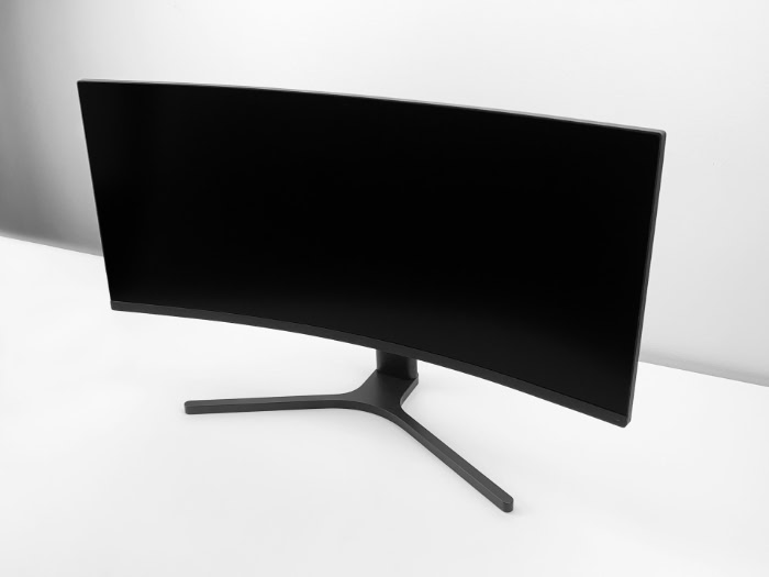 Black curved ultrawide monitor on minimalist white background