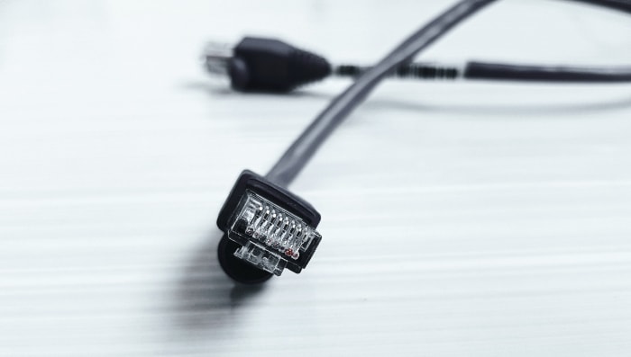 Black ethernet cable on white background