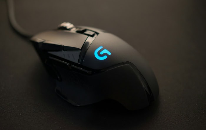 Black gaming mouse with illuminated logo