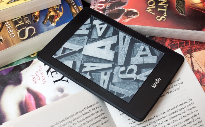 Black kindle on books