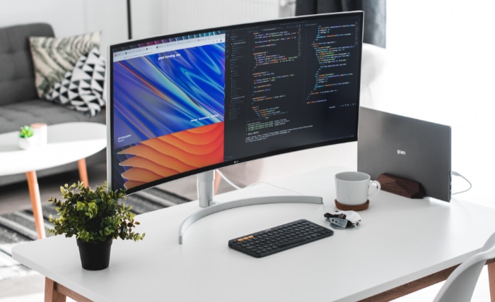 Black monitor on white desk