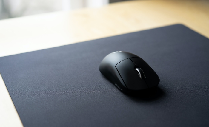 Black mouse on mousepad