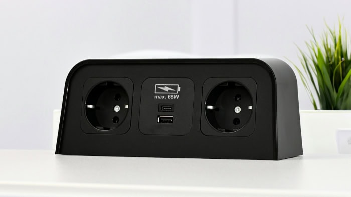 Black power strip with two outlets and USB ports