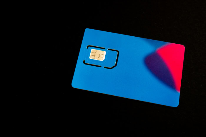 Blue plastic SIM card with gold contact chip
