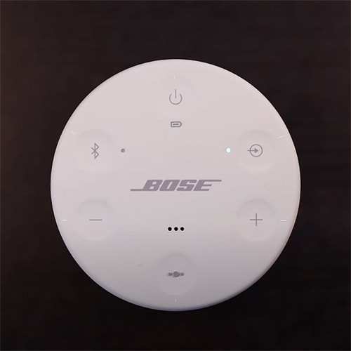 Multifunction button of white Bose SoundLink Revolve