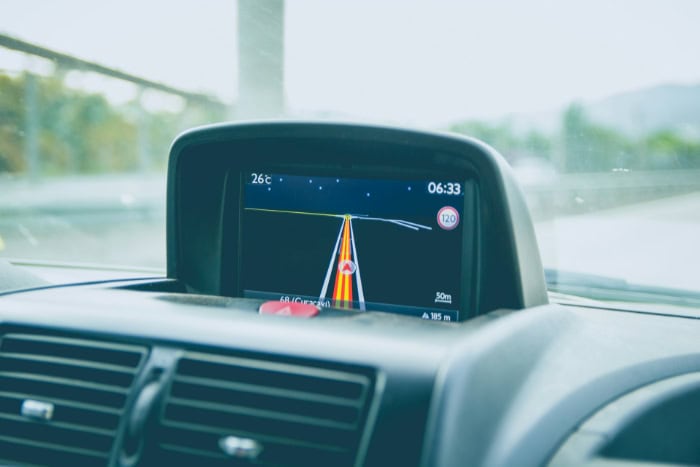 Car dashboard display showing GPS navigation