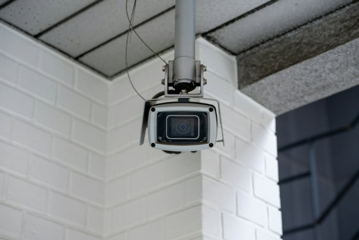 Ceiling mounted outdoor security camera on building