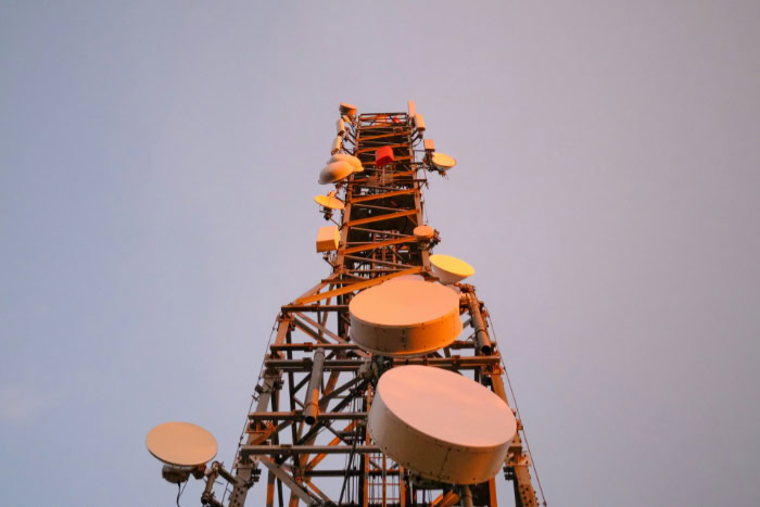 Cellular network tower with multiple antennas and transmitters