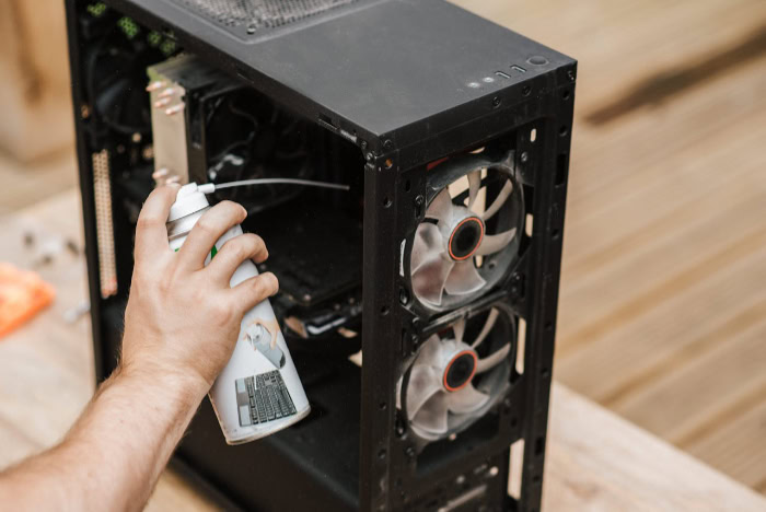Cleaning PC interior with compressed air can