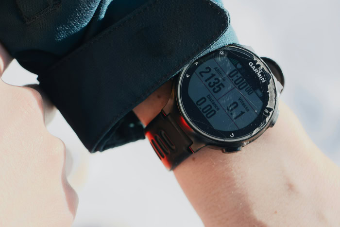 Close up Garmin sports watch showing altitude and distance
