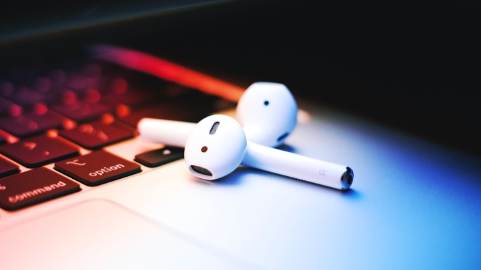 Close up of AirPods on macbook