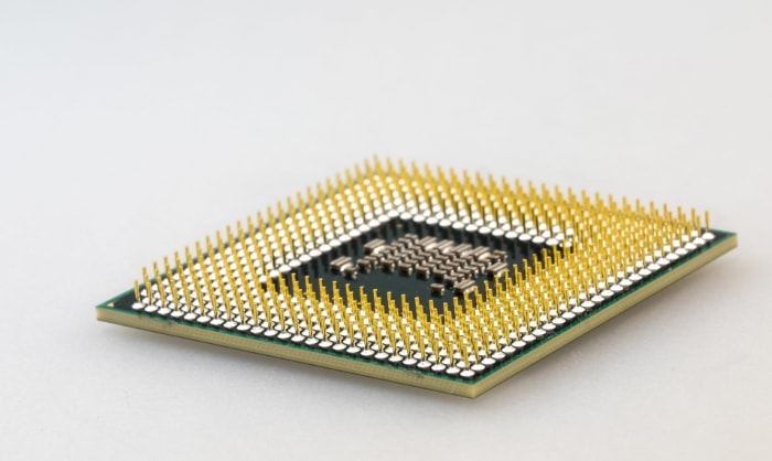 Close up of CPU pin on white surface