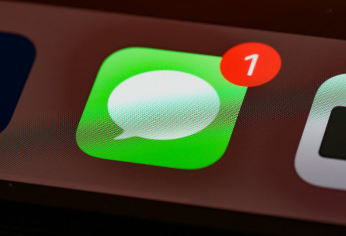 Close up of Messages app icon with unread notification