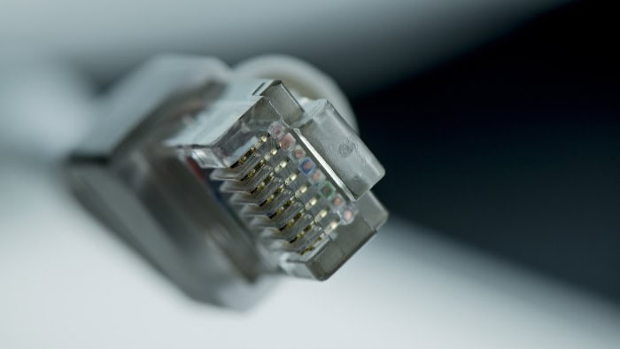 Close up of RJ45 Ethernet connector showing gold plated pins