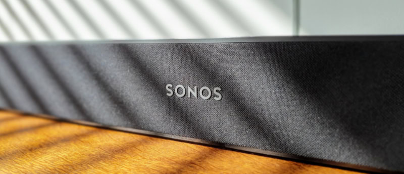 Close up of Sonos logo on a soundbar fabric grille