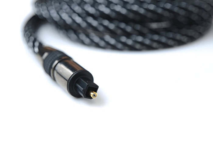 Close up of a black optical audio cable connector