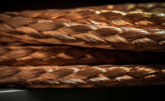 Close up of a braided copper cable with intricate weave patterns