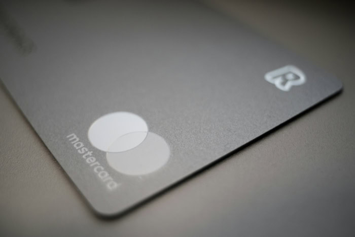 Close up of a silver Mastercard debit card