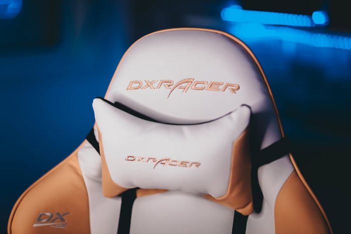 Close up of a white and orange gaming chair