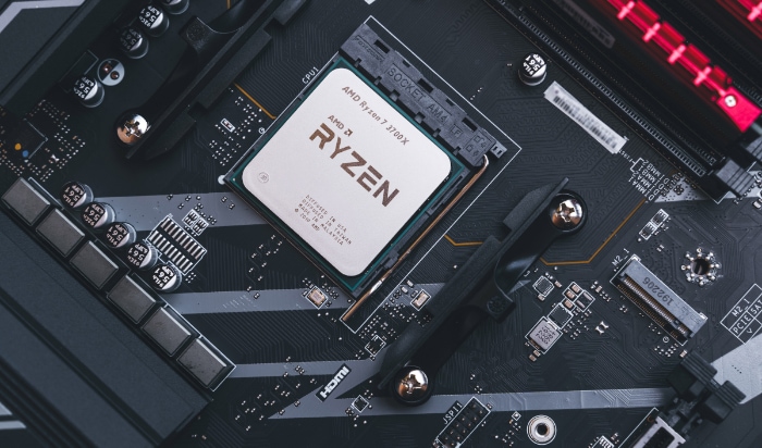 Close up of an AMD Ryzen 3700X CPU installed on a motherboard