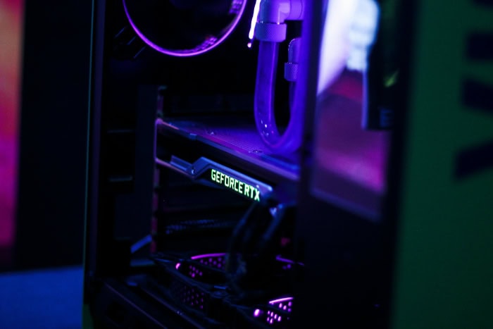 Close up of an illuminated GeForce RTX GPU in a PC