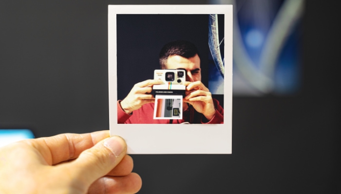 Close up of hand holding a photo film