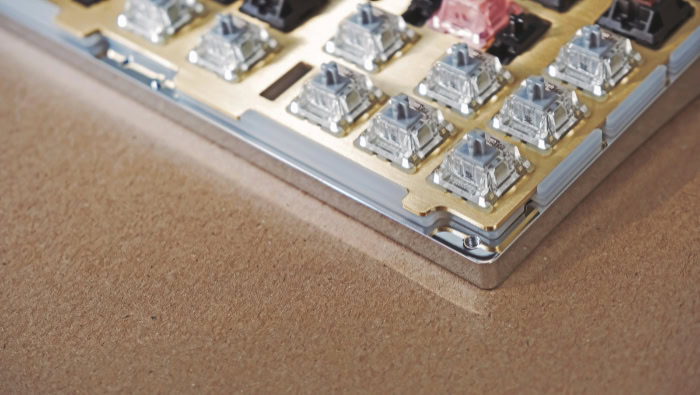 Close up of mechanical keyboard switches on a metal plate